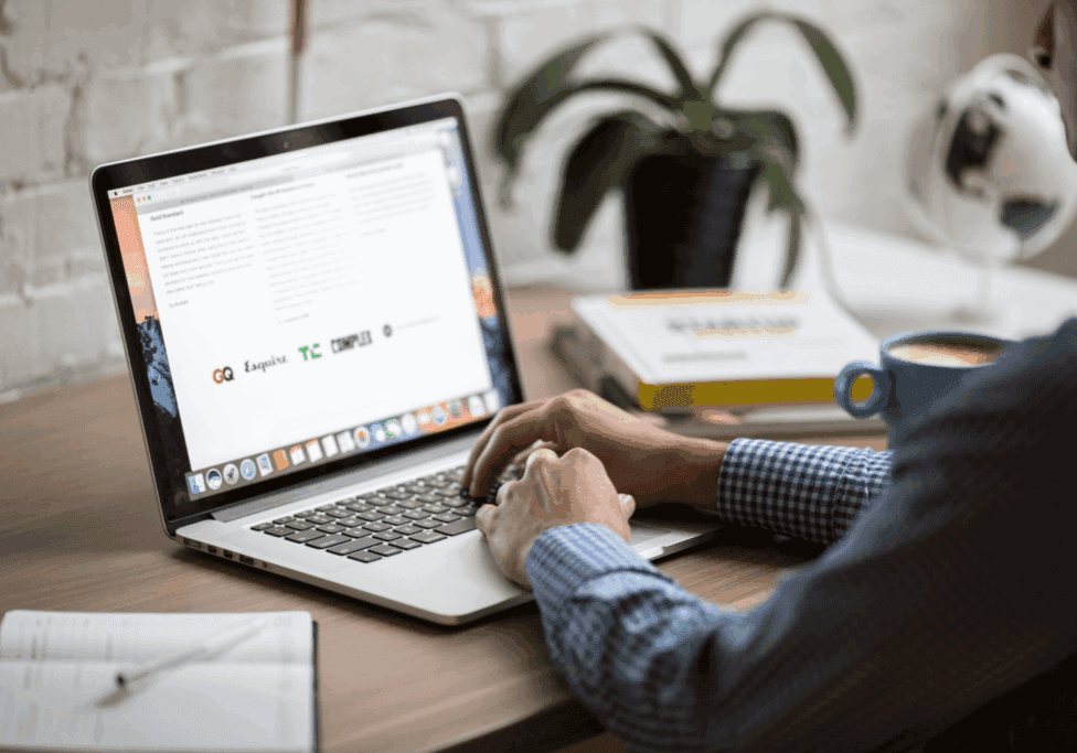 Marketing professional reviewing email newsletter performance metrics like click-through rate and conversions in the HubSpot email analytics dashboard